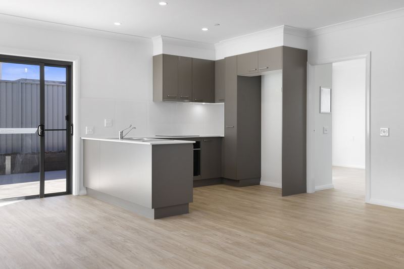 Compact kitchen with sliding door to the courtyard.