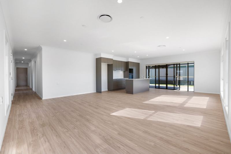 Large open-plan living area with kitchen and hallway.